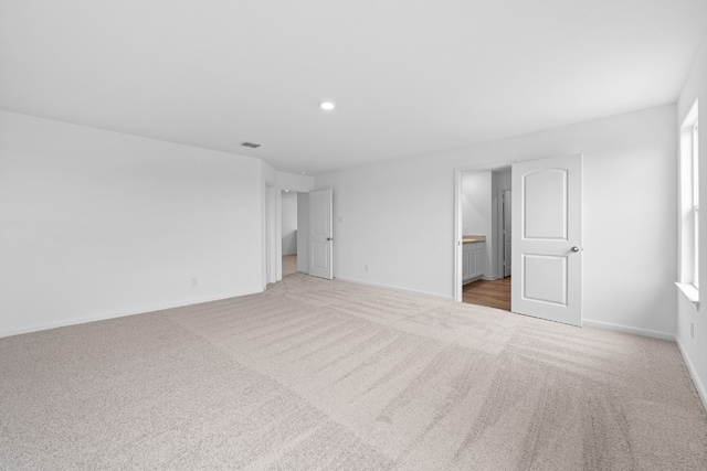 384 Low Pasture Trl, San Marcos, TX 78656 - empty room featuring light colored carpet and recessed lighting