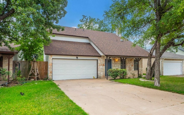 1623 Peachtree Valley Dr, Round Rock, TX 78681 - view of front of home featuring stone siding, a garage, concrete driveway, and a shingled roof
