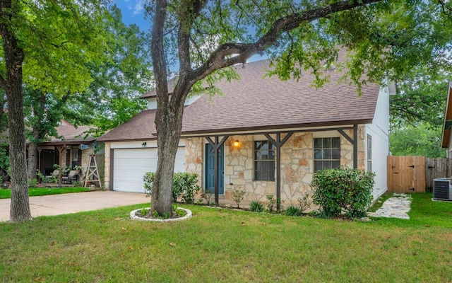 1623 Peachtree Valley Dr, Round Rock, TX 78681 - view of front of house with stone siding, roof with shingles, a garage, and concrete driveway