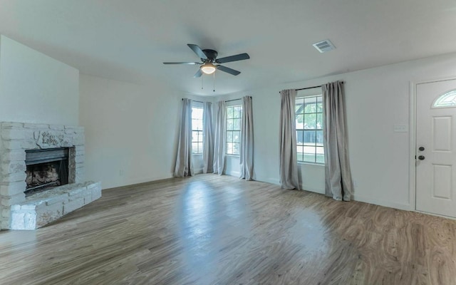1623 Peachtree Valley Dr, Round Rock, TX 78681 - unfurnished living room with wood finished floors, a ceiling fan, and a fireplace