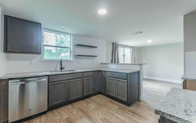 1623 Peachtree Valley Dr, Round Rock, TX 78681 - kitchen featuring dishwasher, a peninsula, light wood finished floors, recessed lighting, and open shelves