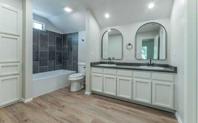 1623 Peachtree Valley Dr, Round Rock, TX 78681 - bathroom featuring double vanity, lofted ceiling, wood finished floors, and shower / bath combination