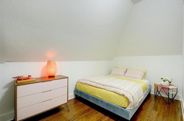 200 Garwood St, Smithville, TX 78957 - bedroom with vaulted ceiling and wood finished floors