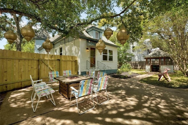 200 Garwood St, Smithville, TX 78957 - view of patio / terrace featuring an outdoor fire pit and a gazebo
