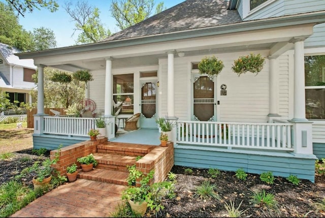 200 Garwood St, Smithville, TX 78957 - entrance to property with covered porch and roof with shingles