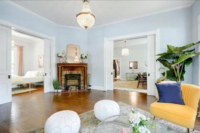 200 Garwood St, Smithville, TX 78957 - living area with wood finished floors, ornamental molding, and a fireplace