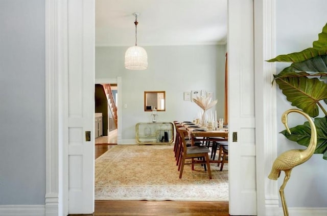 200 Garwood St, Smithville, TX 78957 - dining area featuring wood finished floors and ornamental molding