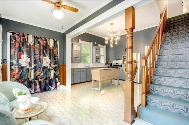 200 Garwood St, Smithville, TX 78957 - interior space with ornamental molding, tile patterned floors, a chandelier, a ceiling fan, and wainscoting