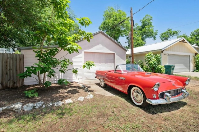 200 Garwood St, Smithville, TX 78957 - view of front facade featuring a garage and an outdoor structure