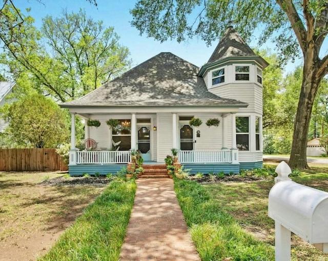 200 Garwood St, Smithville, TX 78957 - victorian house with covered porch and a shingled roof