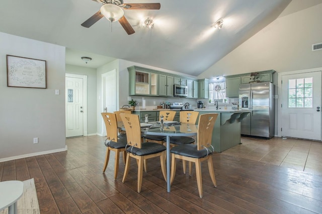 14596 Touchstone Rd Unit 3, Atascosa, TX 78002 - dining area with a ceiling fan, dark wood finished floors, and high vaulted ceiling