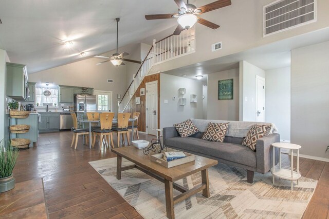 14596 Touchstone Rd Unit 3, Atascosa, TX 78002 - living room with a ceiling fan, high vaulted ceiling, and dark wood-type flooring