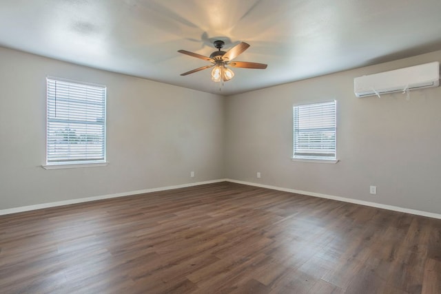14596 Touchstone Rd Unit 3, Atascosa, TX 78002 - unfurnished room featuring plenty of natural light, an AC wall unit, ceiling fan, and dark wood finished floors