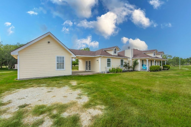 14596 Touchstone Rd Unit 3, Atascosa, TX 78002 - rear view of house with a lawn, french doors, and a porch