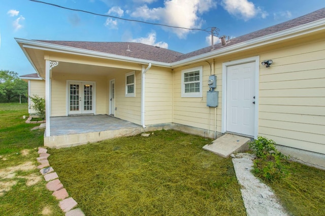 14596 Touchstone Rd Unit 3, Atascosa, TX 78002 - doorway to property featuring french doors and a lawn