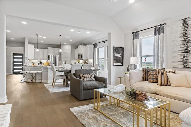 113 Charro Ct, Georgetown, TX 78633 - living room with light wood-type flooring, recessed lighting, and vaulted ceiling