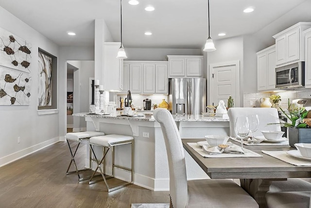 113 Charro Ct, Georgetown, TX 78633 - kitchen with stainless steel appliances, decorative backsplash, dark wood-style flooring, and recessed lighting