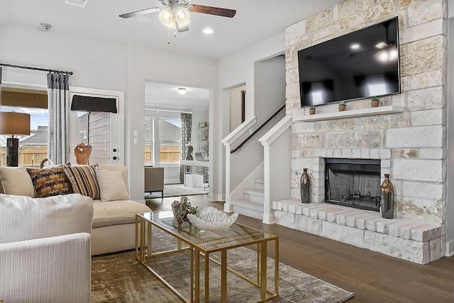 113 Charro Ct, Georgetown, TX 78633 - living room with ceiling fan, healthy amount of natural light, wood finished floors, and a brick fireplace
