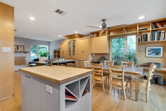 3309 Westhill Unit A & B, Austin, TX 78704 - kitchen with butcher block countertops, a center island, ceiling fan, recessed lighting, and light wood-style floors