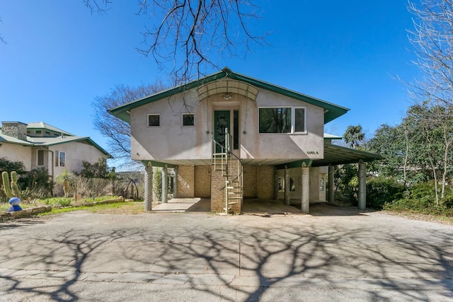 3309 Westhill Unit A & B, Austin, TX 78704 - view of front of property with driveway, a carport, and stucco siding