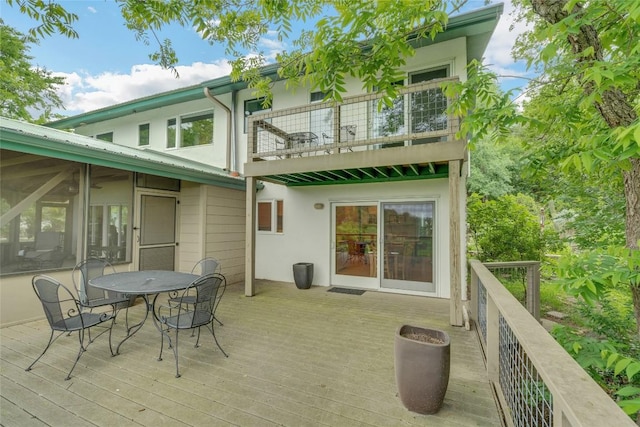 3309 Westhill Unit A & B, Austin, TX 78704 - rear view of house with a balcony, outdoor dining area, stucco siding, and a deck