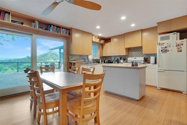 3309 Westhill Unit A & B, Austin, TX 78704 - kitchen with freestanding refrigerator, range, backsplash, light wood-type flooring, and recessed lighting