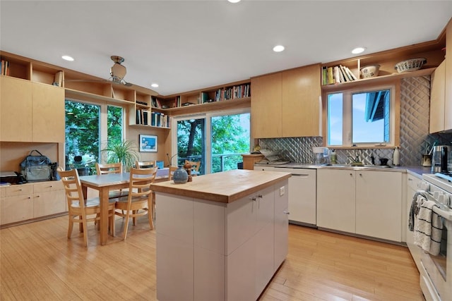 3309 Westhill Unit A & B, Austin, TX 78704 - kitchen featuring white appliances, tasteful backsplash, light wood-style floors, plenty of natural light, and recessed lighting