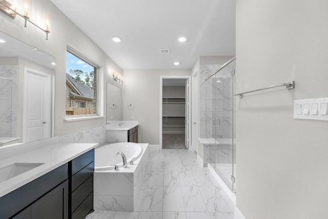 109 Charro Ct, Georgetown, TX 78633 - full bath featuring marble finish floors, two vanities, a marble finish shower, a bath, and recessed lighting
