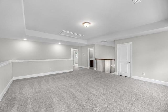 109 Charro Ct, Georgetown, TX 78633 - carpeted spare room with attic access, a raised ceiling, and recessed lighting