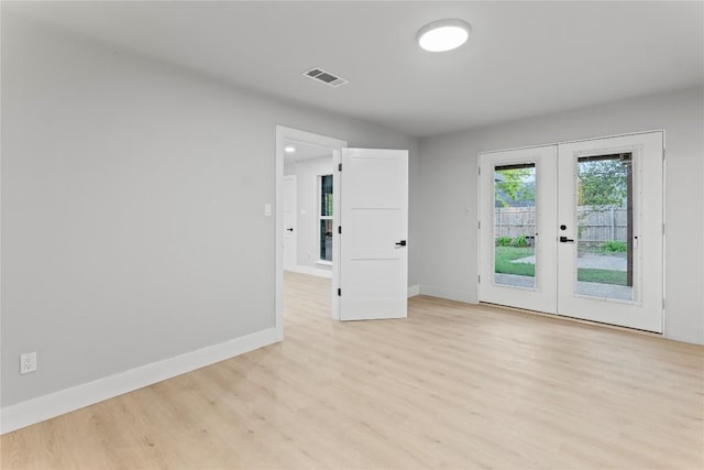 3907 Carmel Dr, Austin, TX 78721 - spare room featuring french doors and light wood finished floors