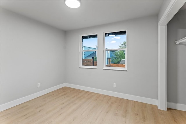 3907 Carmel Dr, Austin, TX 78721 - unfurnished bedroom featuring baseboards and wood finished floors