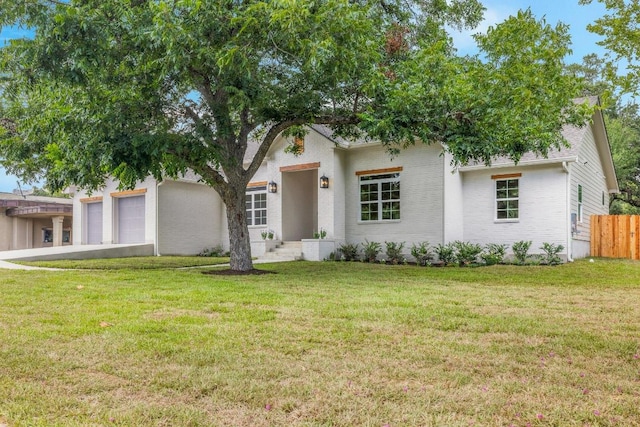 271 S College St, La Grange, TX 78945 - view of front facade featuring a garage and concrete driveway
