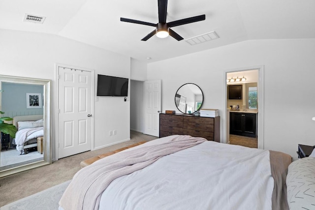 1620 Rockland Dr Unit 167, Austin, TX 78748 - bedroom featuring vaulted ceiling, connected bathroom, light colored carpet, and ceiling fan