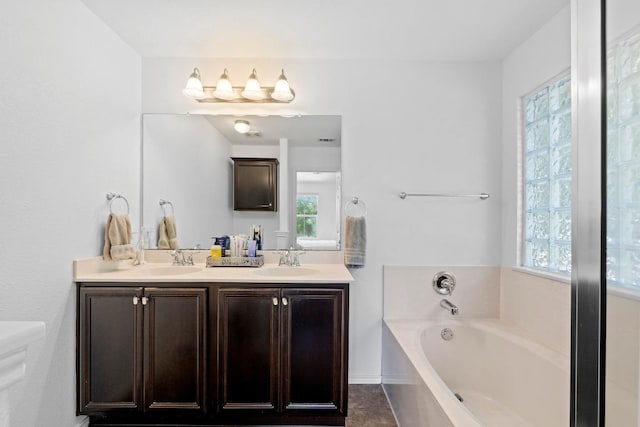1620 Rockland Dr Unit 167, Austin, TX 78748 - full bath with healthy amount of natural light, double vanity, and a garden tub