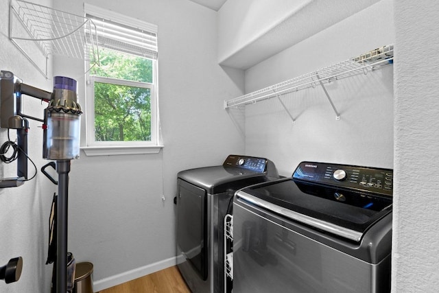 1620 Rockland Dr Unit 167, Austin, TX 78748 - laundry room with washer and dryer and wood finished floors