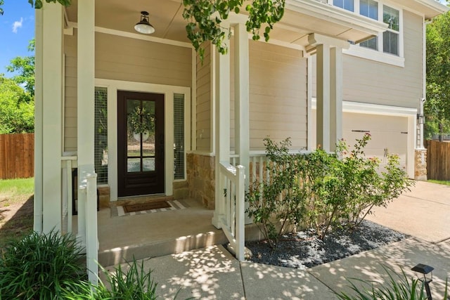 1620 Rockland Dr Unit 167, Austin, TX 78748 - entrance to property with covered porch, stone siding, a garage, and driveway
