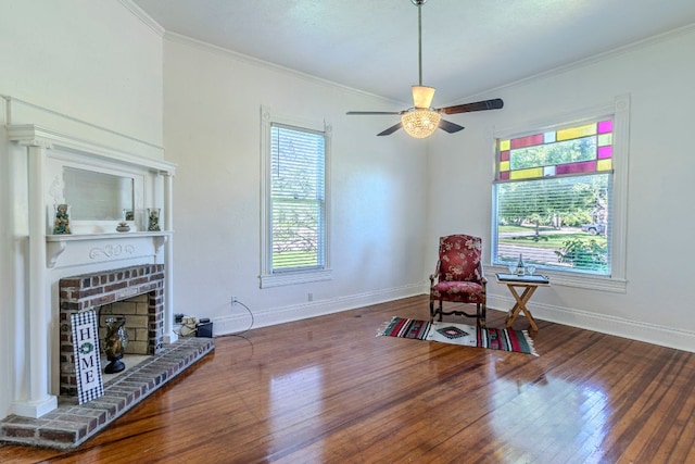 618 N Penelope St, Belton, TX 76513 - sitting room with hardwood / wood-style floors, ornamental molding, ceiling fan, and a fireplace