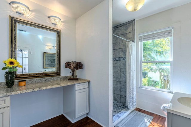 618 N Penelope St, Belton, TX 76513 - full bath featuring vanity, a stall shower, and wood finished floors