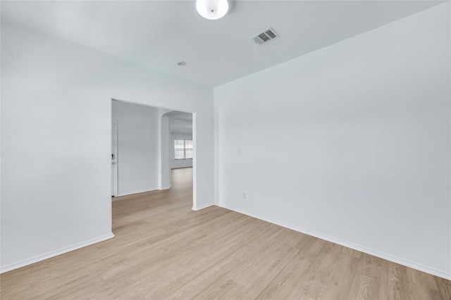 19700 San Chisolm Dr, Round Rock, TX 78664 - spare room with light wood-type flooring and arched walkways