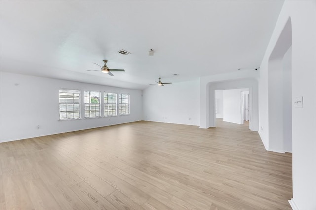 19700 San Chisolm Dr, Round Rock, TX 78664 - unfurnished room featuring ceiling fan, light wood-type flooring, and arched walkways