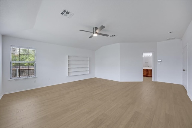 19700 San Chisolm Dr, Round Rock, TX 78664 - empty room with built in features, light wood-style floors, ceiling fan, and vaulted ceiling