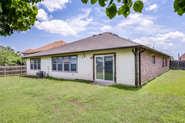 19700 San Chisolm Dr, Round Rock, TX 78664 - rear view of house with a fenced backyard, brick siding, and a shingled roof