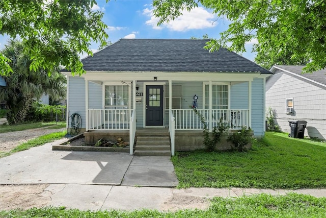 1211 S 17th St, Temple, TX 76504 - bungalow-style home with a shingled roof, a porch, and a front yard
