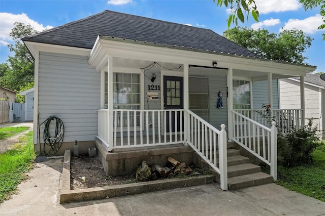 1211 S 17th St, Temple, TX 76504 - view of front of home featuring a shingled roof and a porch