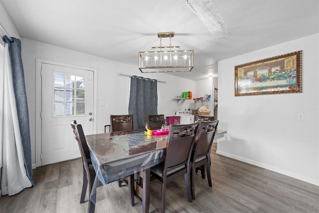 1211 S 17th St, Temple, TX 76504 - dining space with a chandelier and wood finished floors