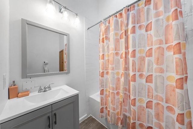 1211 S 17th St, Temple, TX 76504 - full bathroom featuring vanity, shower / tub combo with curtain, and wood finished floors