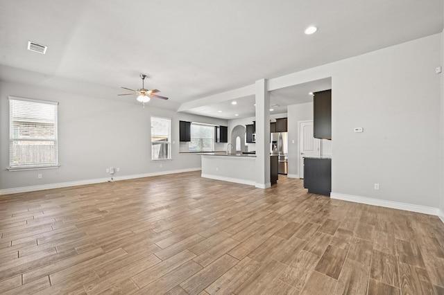 19113 Melwas Way, Pflugerville, TX 78660 - unfurnished living room with a ceiling fan, light wood-style floors, and recessed lighting