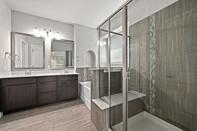 19113 Melwas Way, Pflugerville, TX 78660 - full bathroom with a stall shower, double vanity, a bath, and wainscoting