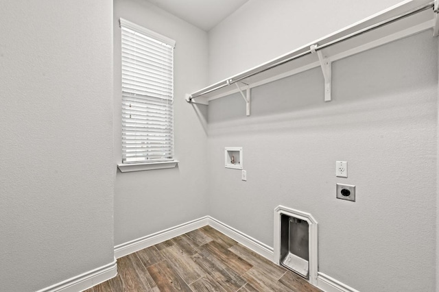 19113 Melwas Way, Pflugerville, TX 78660 - laundry area featuring hookup for an electric dryer, hookup for a washing machine, and dark wood-style flooring
