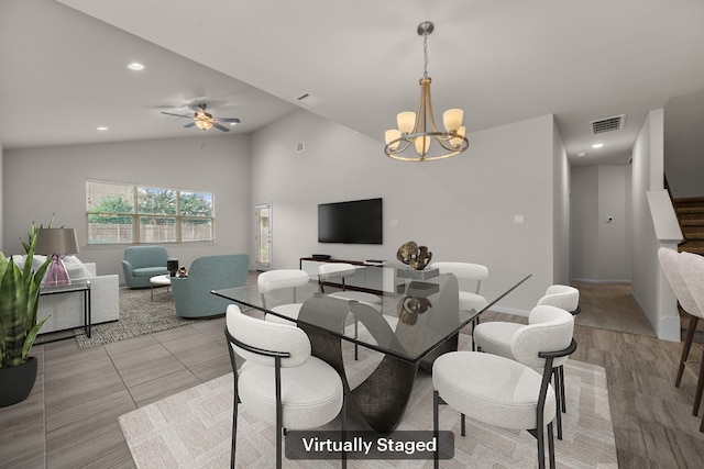 205 Falkland St, Hutto, TX 78634 - dining space featuring lofted ceiling, a chandelier, stairs, recessed lighting, and a ceiling fan